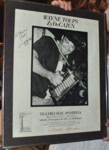 Wayne Toups receives a poster from his South American Tour in 1987 at The Gueydan Duck Festival. Photo by Judy Johnson